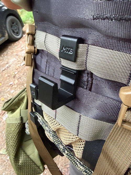 Black SC3 platform hook mounted on a hunting saddle, angled view