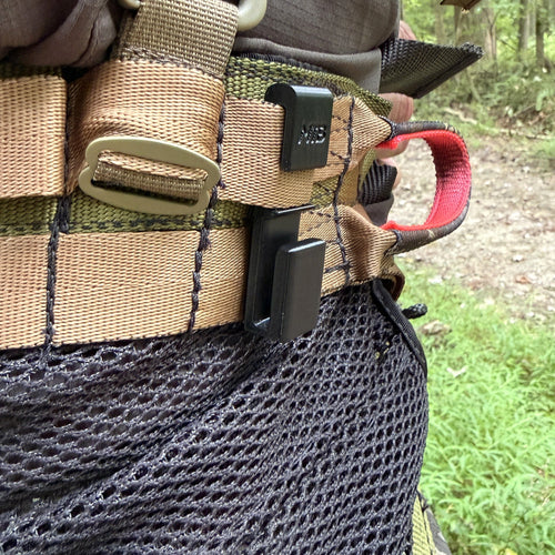 Close view of SC1 Cord Hook installed on hunting equipment